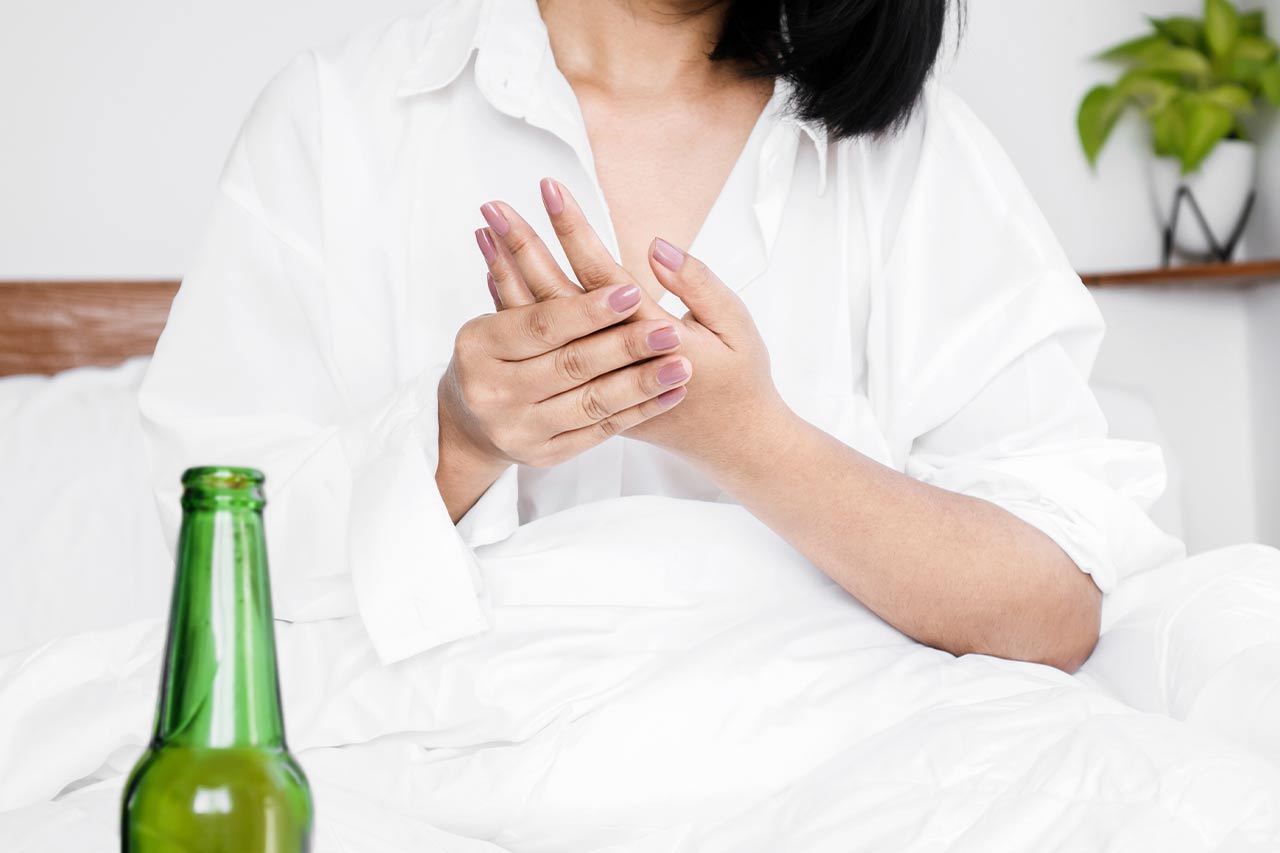 woman massaging her hand