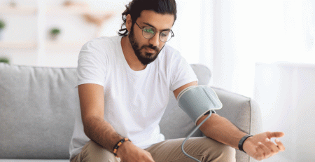 man using the blood pressure device