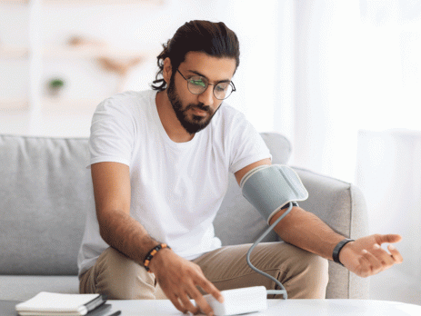 man using the blood pressure device