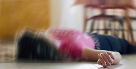 person lying on the dining floor