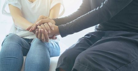 woman and man holding hands