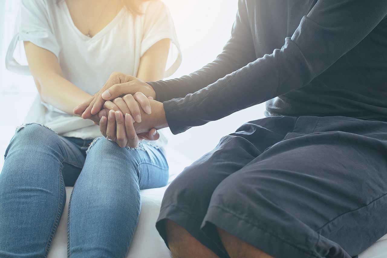 woman and man holding hands