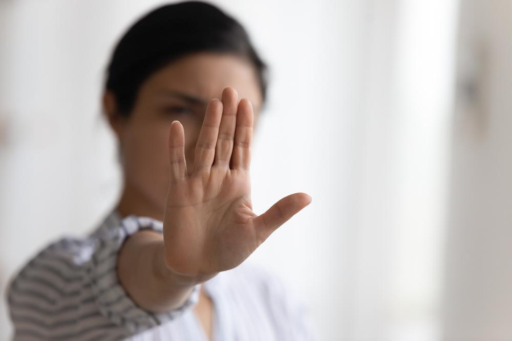 woman raising his palm