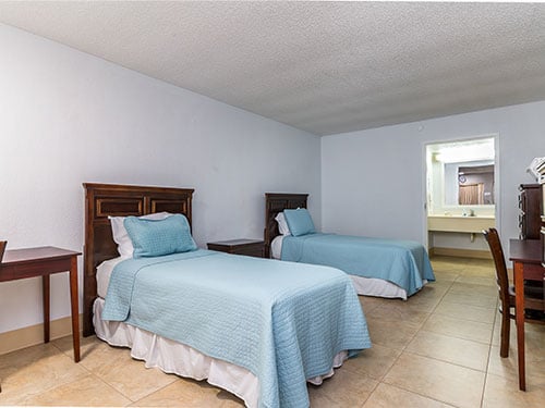 Shared residential bedroom with two twin beds at Behavioral Health of the Palm Beaches